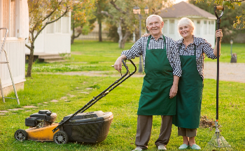 Smiling senior gardeners